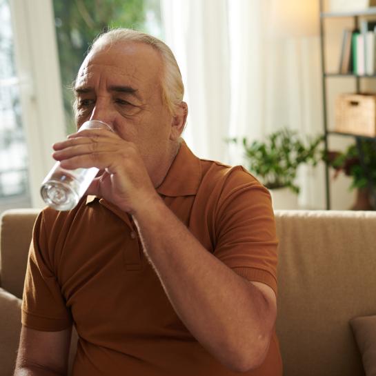 Senior man drinking glass of water