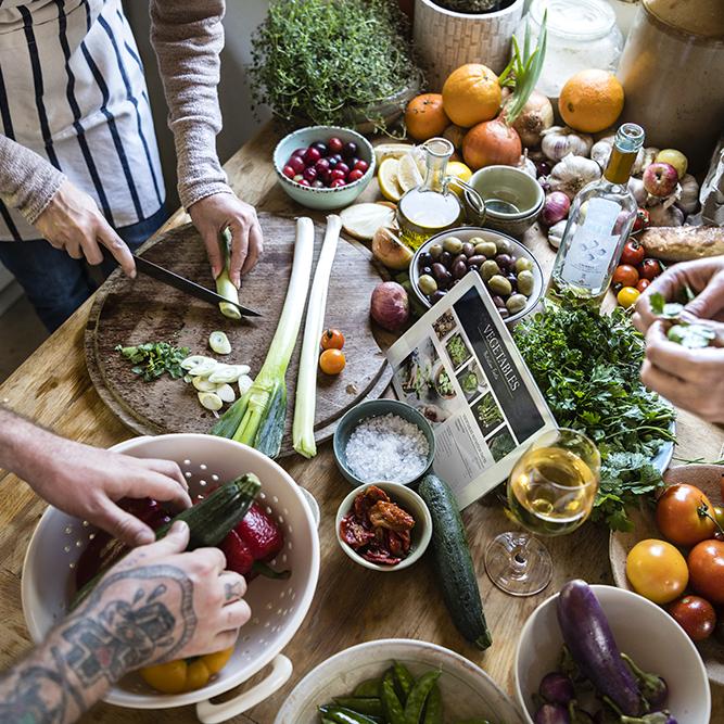 people cooking healthy food in the kitchen