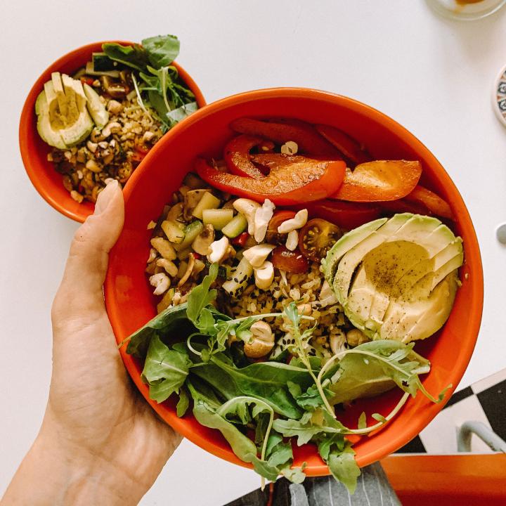 Healthy salad in orange bowl