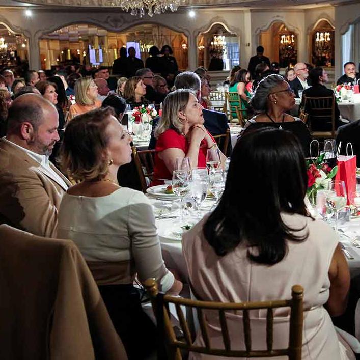 People sitting at table for a dinner meeting