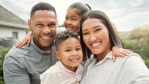 Smiling African American husband, wife, and children