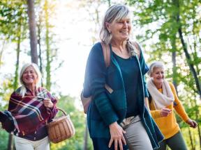 Three senior women walking outdoors