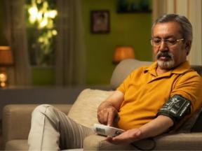 Man checking blood pressure with cuff