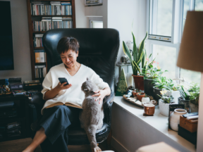 Woman receiving dialysis at home in chair