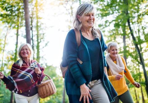 Three senior women walking outdoors