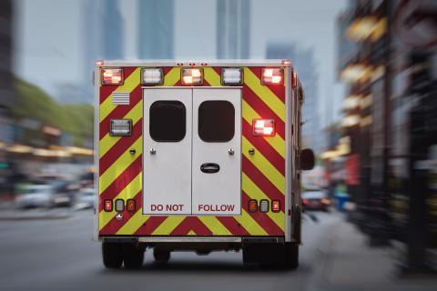 Back of ambulance driving down street