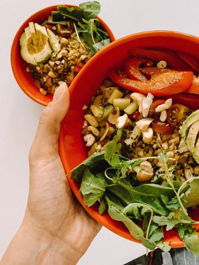 Healthy salad in orange bowl