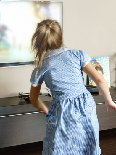 A mom and daughter play a dance video game